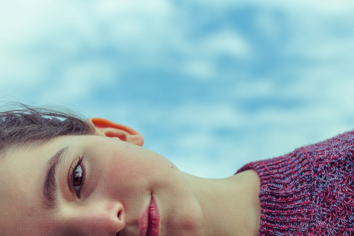 Photo of a female embodying how to think less and live more.