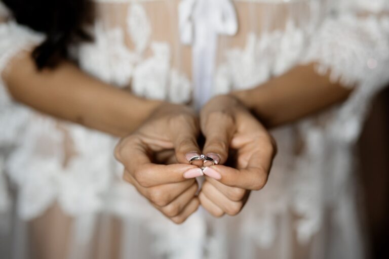 bride showing off her ring reflecting women’s identity in marriage