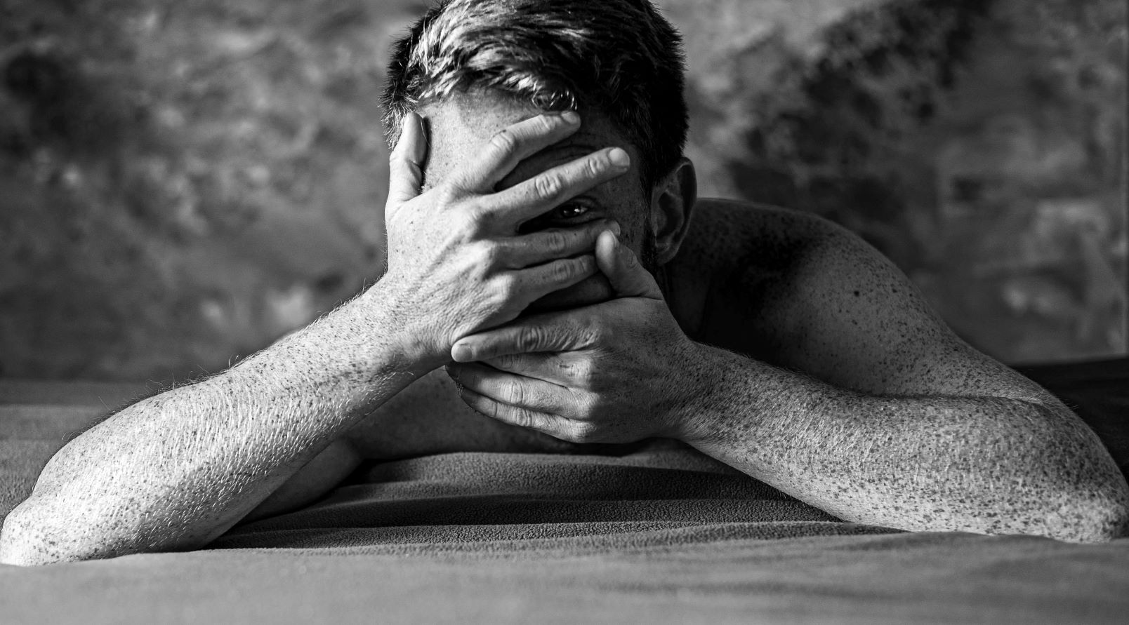 man covering his face with his hands a creative depiction of the complex psychology of men
