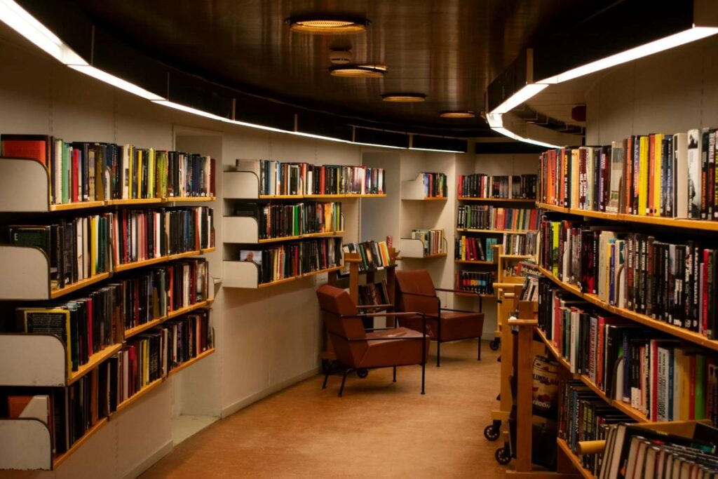 A library corridor with shelves full of books.