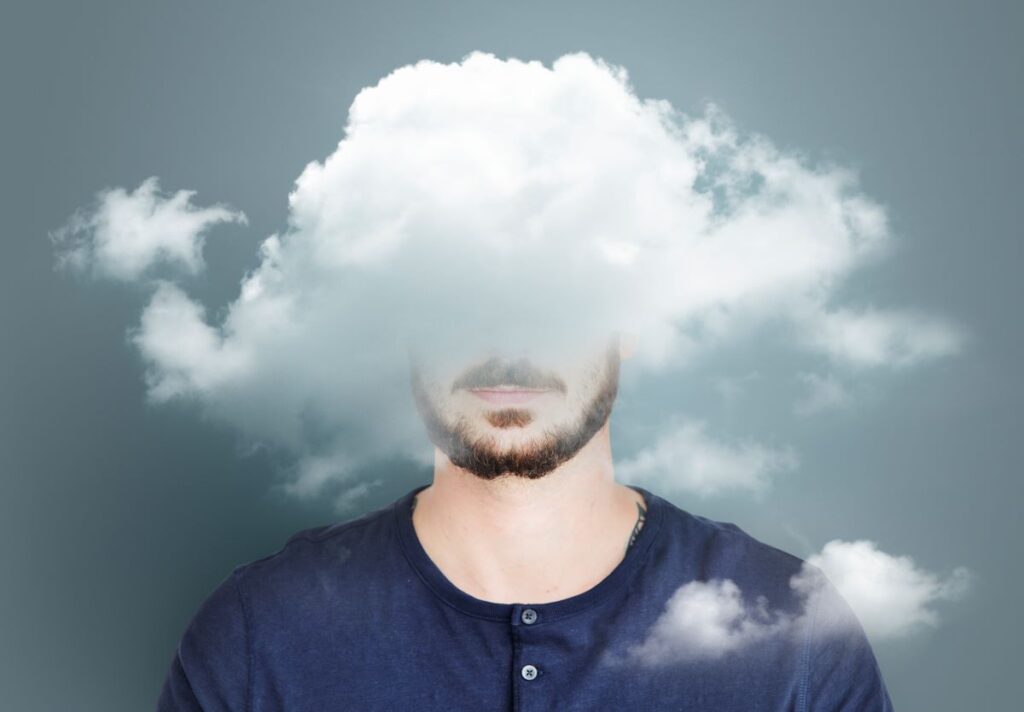 A man with a cloud over his head.