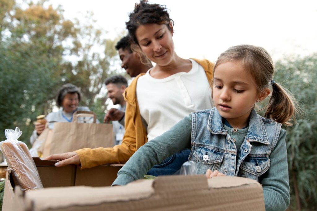 A family engaged in giving to charity.